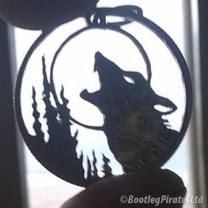 Howling Wolf at Moon, Hand Cut Coin Pendant.